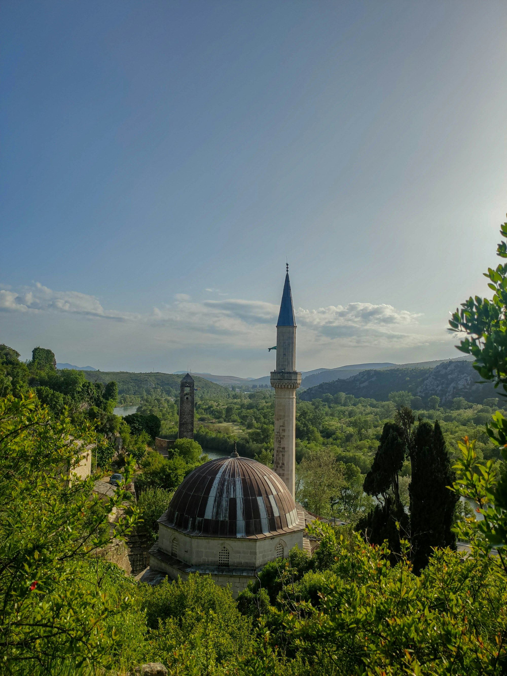https://thehalalplanet.com Stunning view overlooking mosque and clock tower, Počitelj, Bosnia and Herzegovina