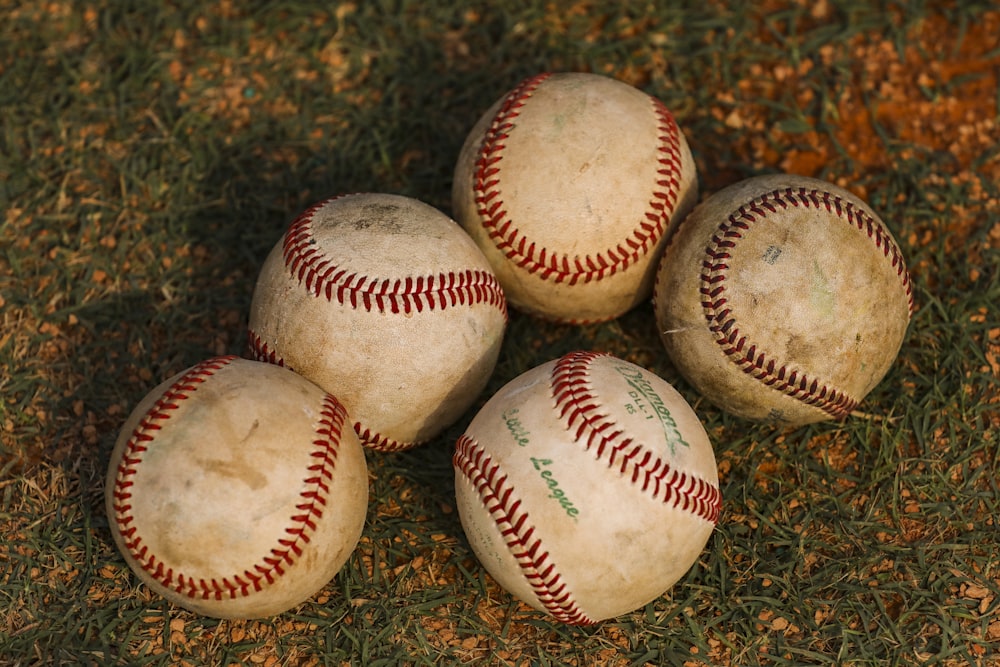 a group of baseballs on the ground