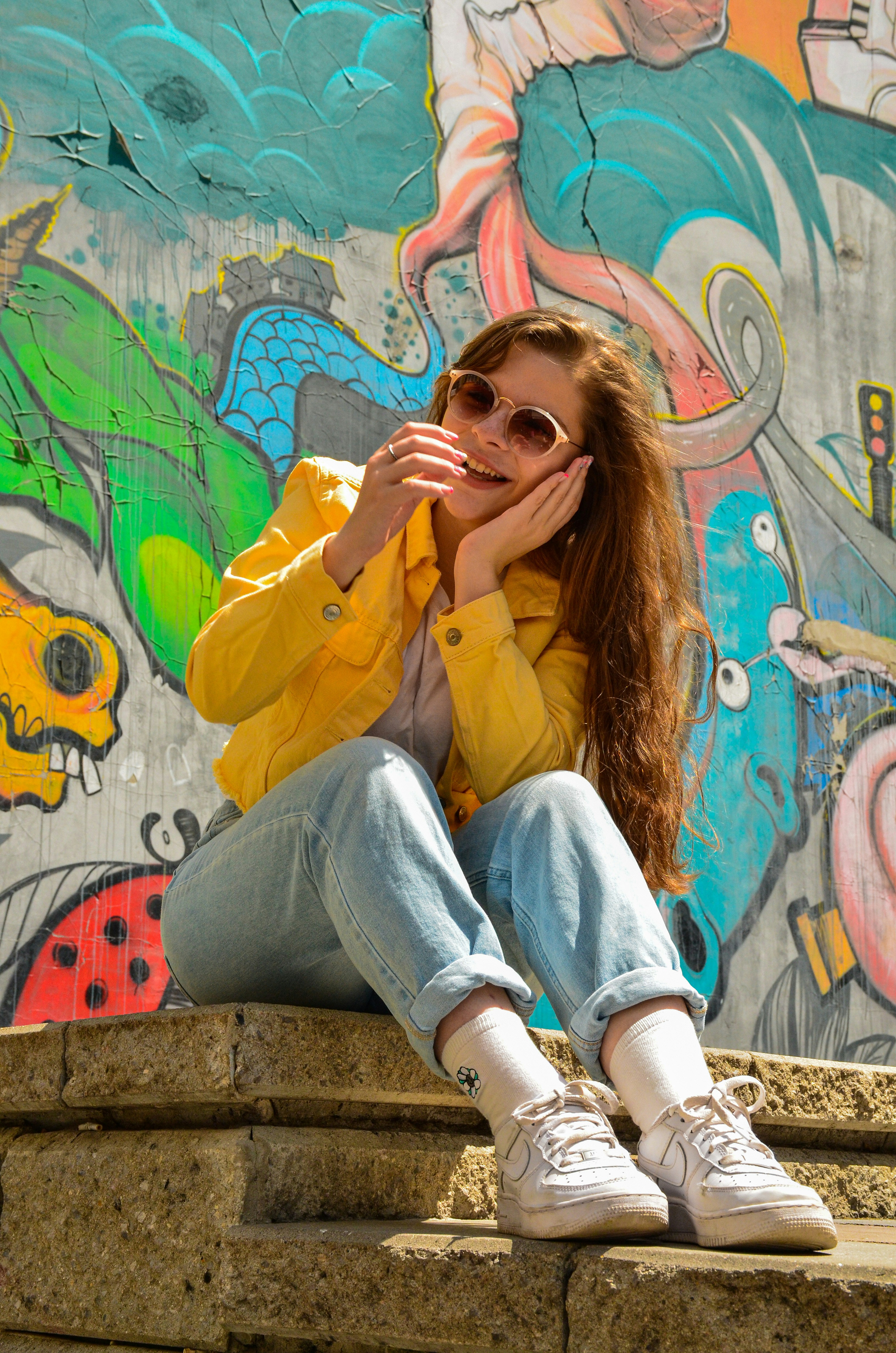 a woman sitting on a ledge