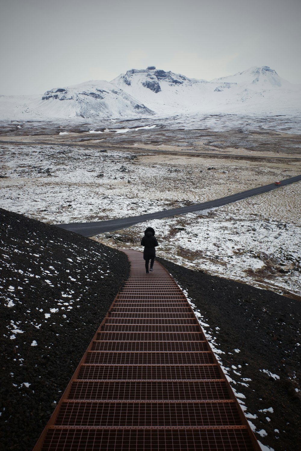 a person walking on a snowy road