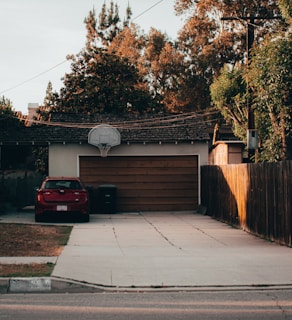 a garage with a car parked in front of it