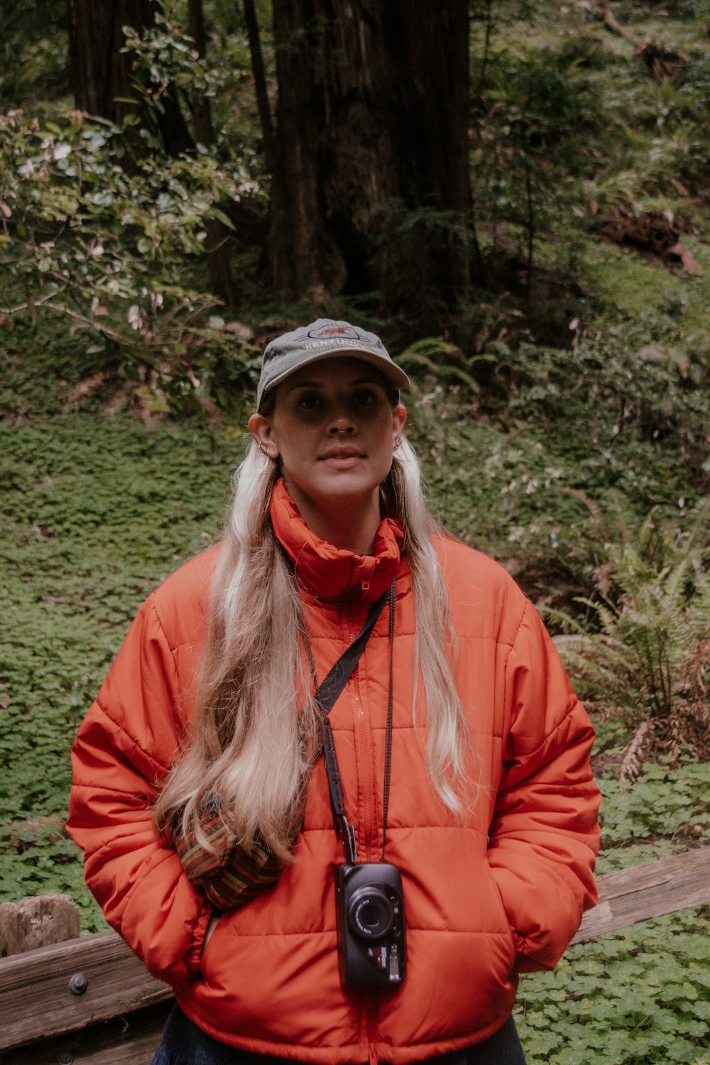 a person wearing a hat and a red jacket