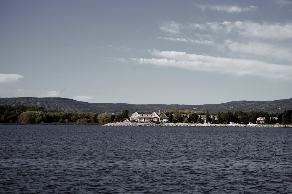 a house on a hill by the water