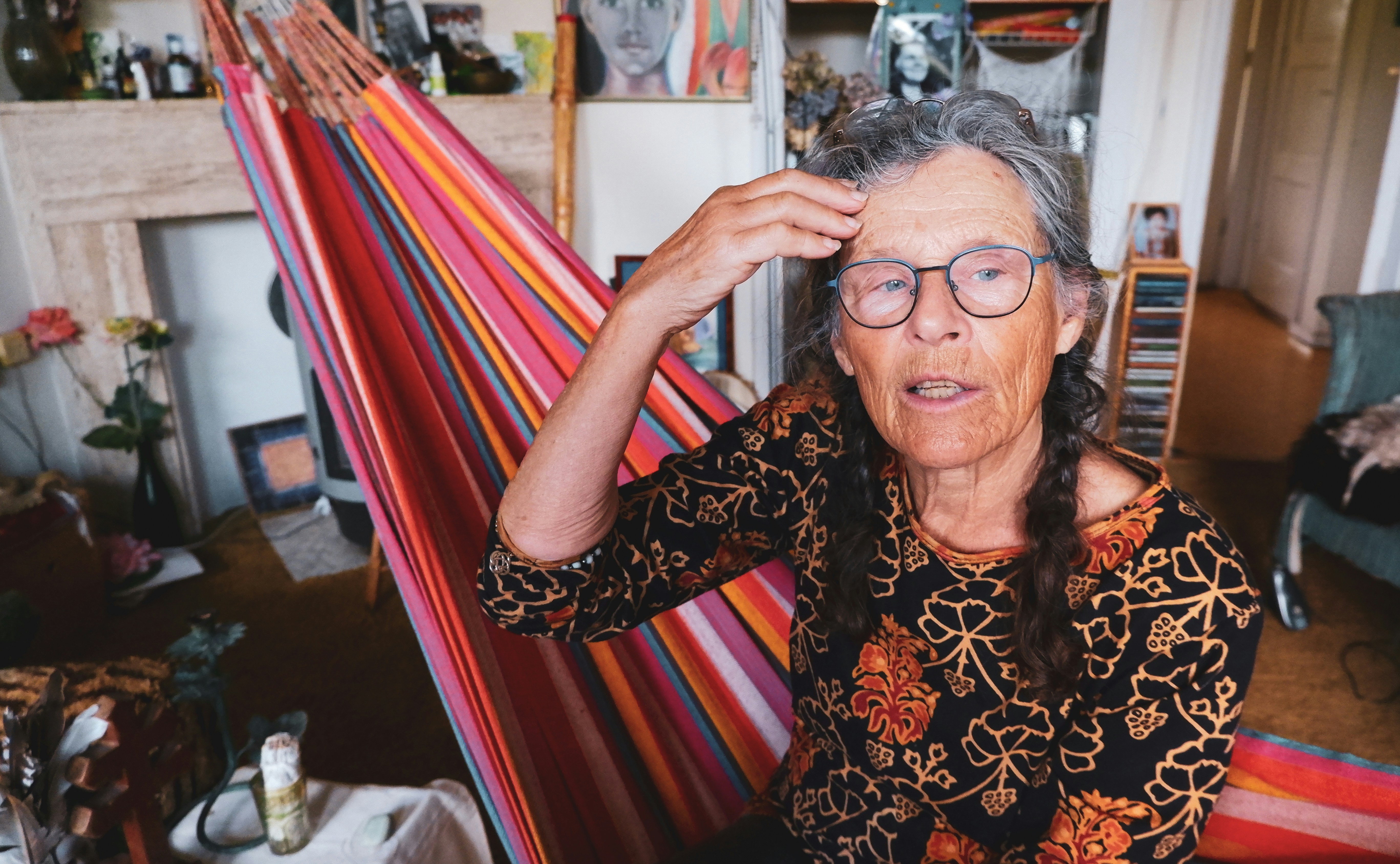 a person holding a piece of art