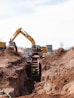 a construction vehicle in a dirt field