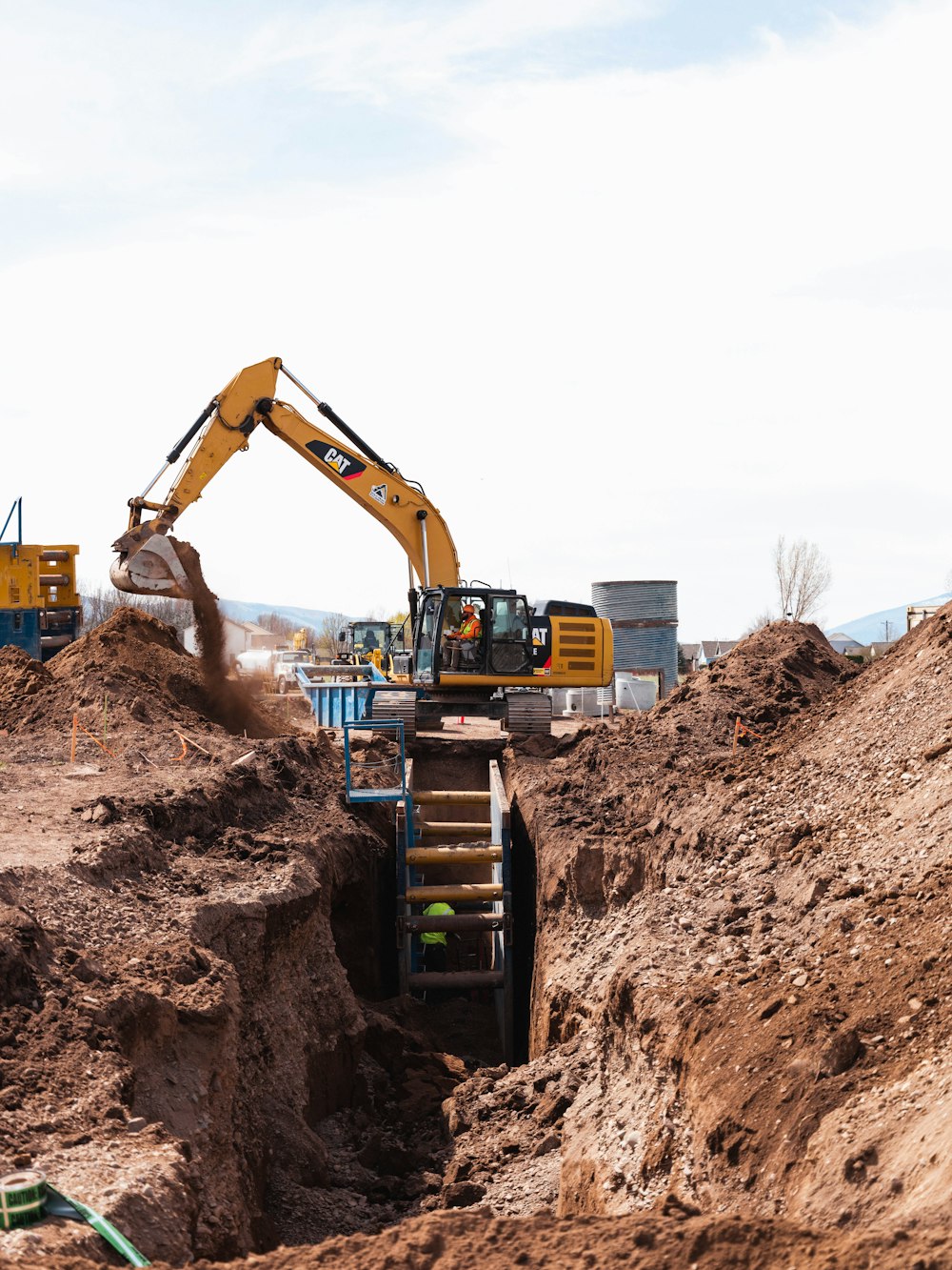 a construction vehicle in a dirt field