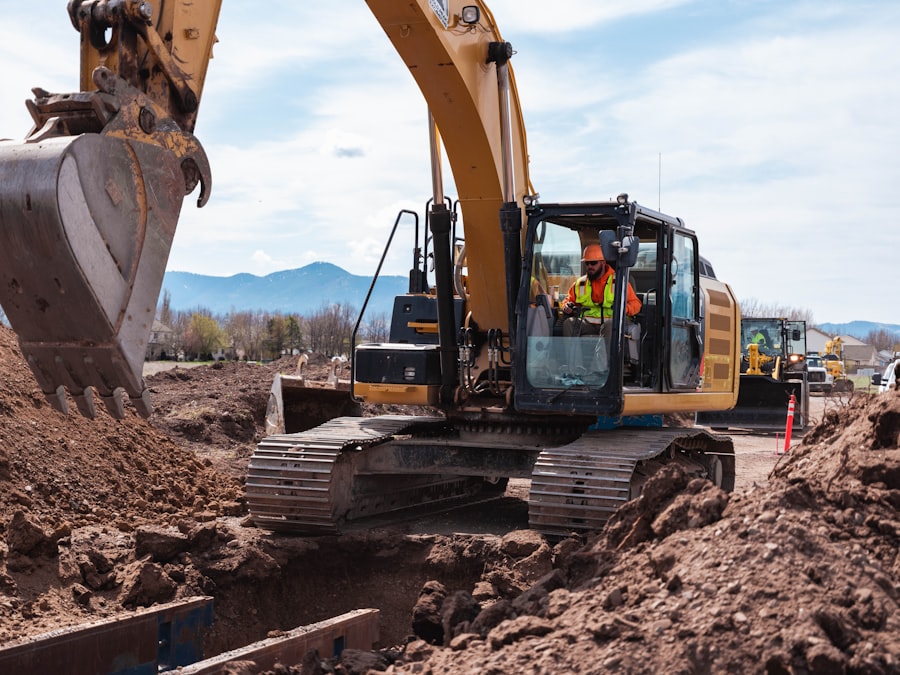 Bulldozer grading and leveling earth on a large commercial construction site
