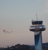 An airplane taking off into a clear sky, representing the beginning of a new journey abroad.