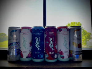 A vibrant can of Divorox energy drink surrounded by fresh fruits representing its multiple flavors.