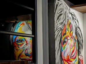 An expressive portrait painting with vibrant splashes of color highlighting emotions