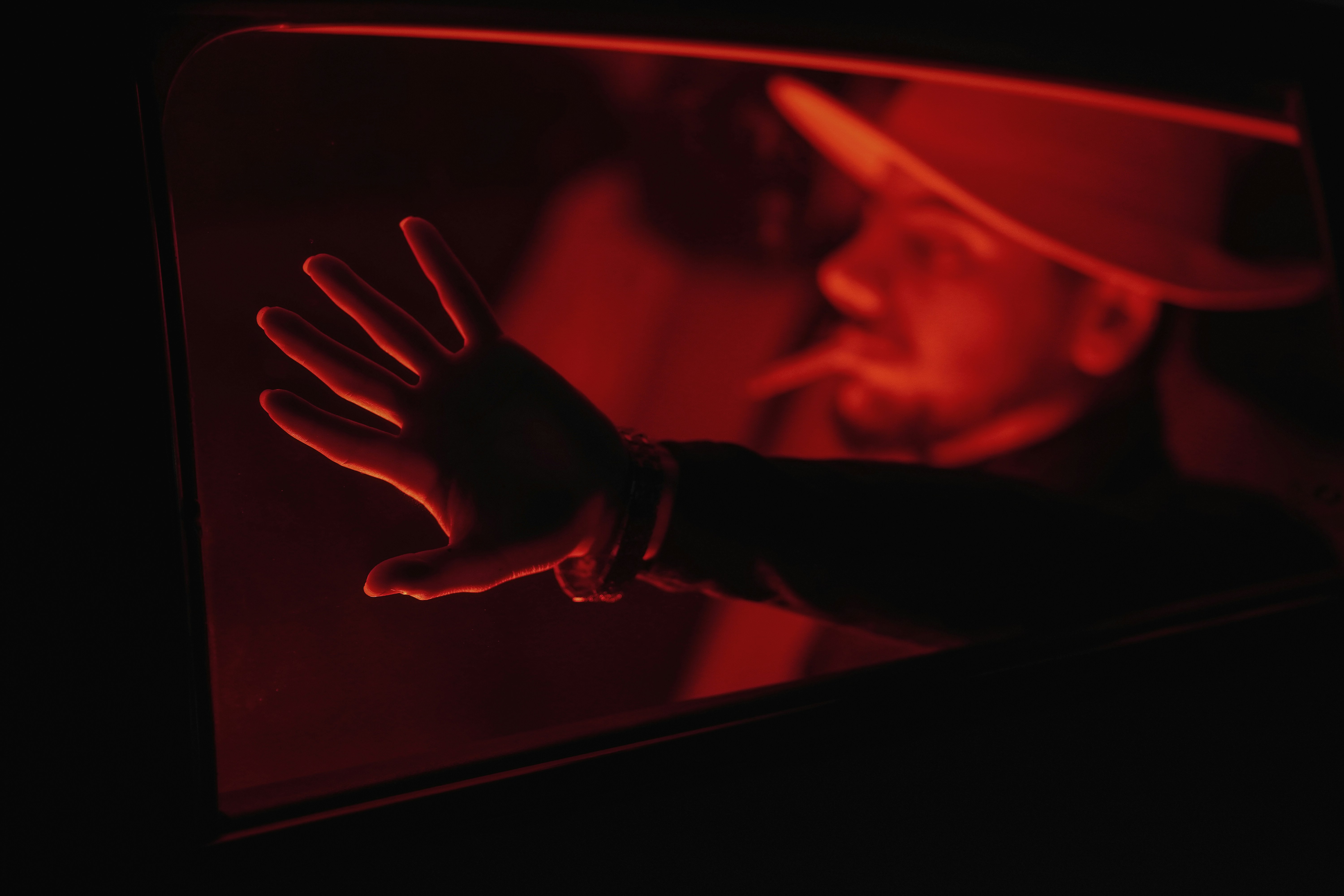 Sulaymaniyah, Iraq - lonely boy smoking in Red