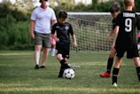 a group of boys playing football