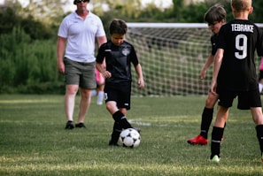 a group of boys playing football