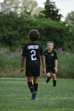 a couple of boys in a field