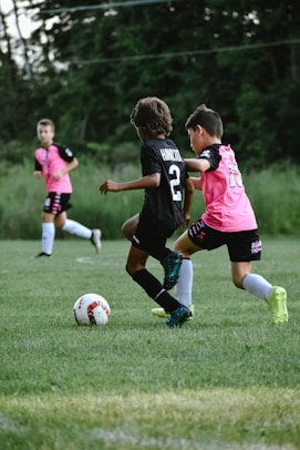 kids playing football on a field