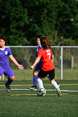 a group of people play football