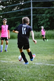 a group of kids playing football