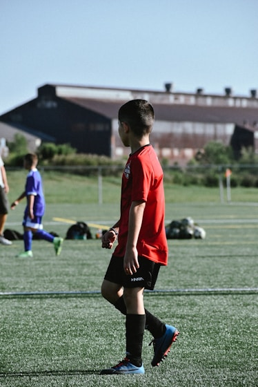 a boy in a red shirt