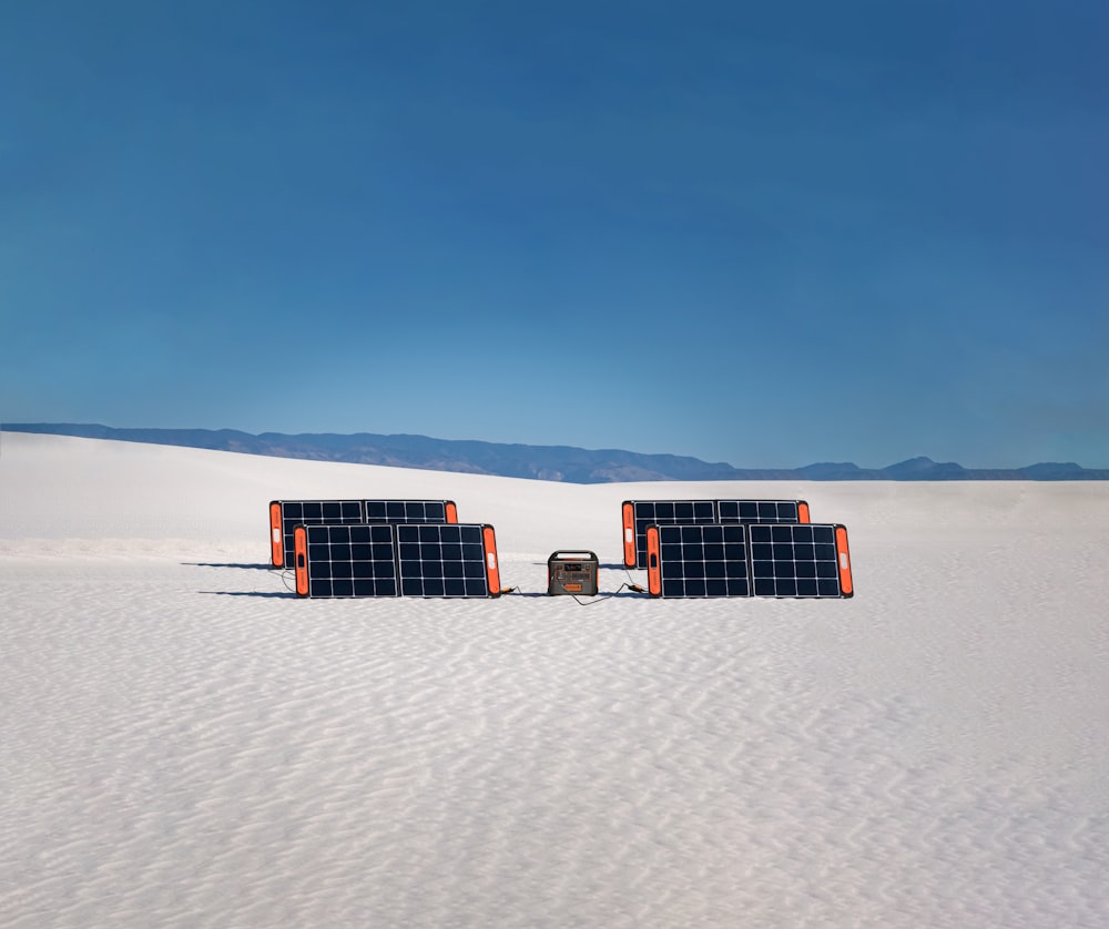 a group of metal structures in a snowy area