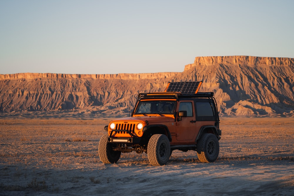 a truck driving through a desert