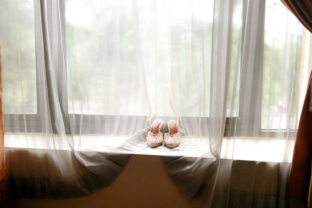 a pair of shoes on a bed