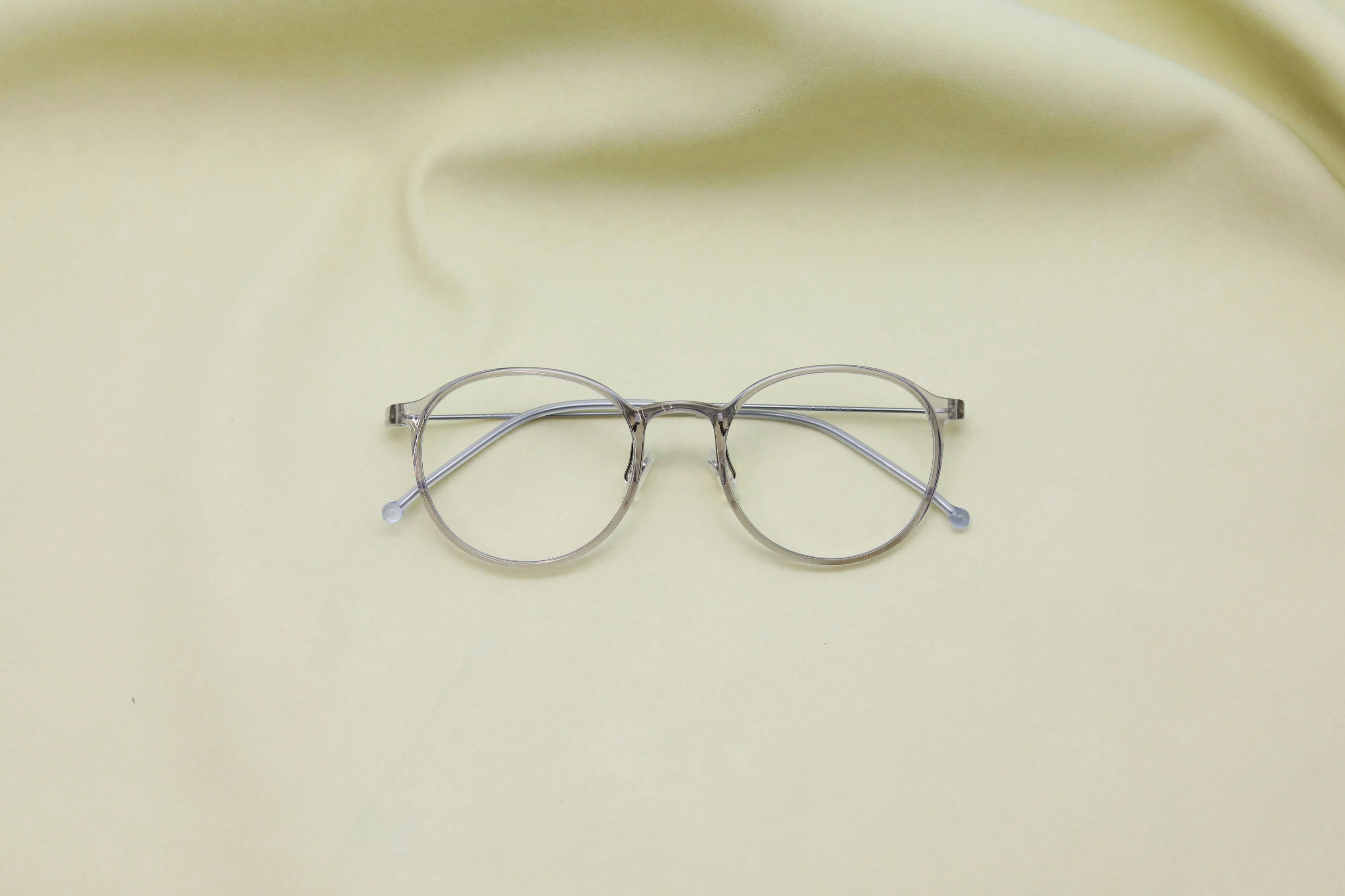 a pair of glasses sitting on top of a table