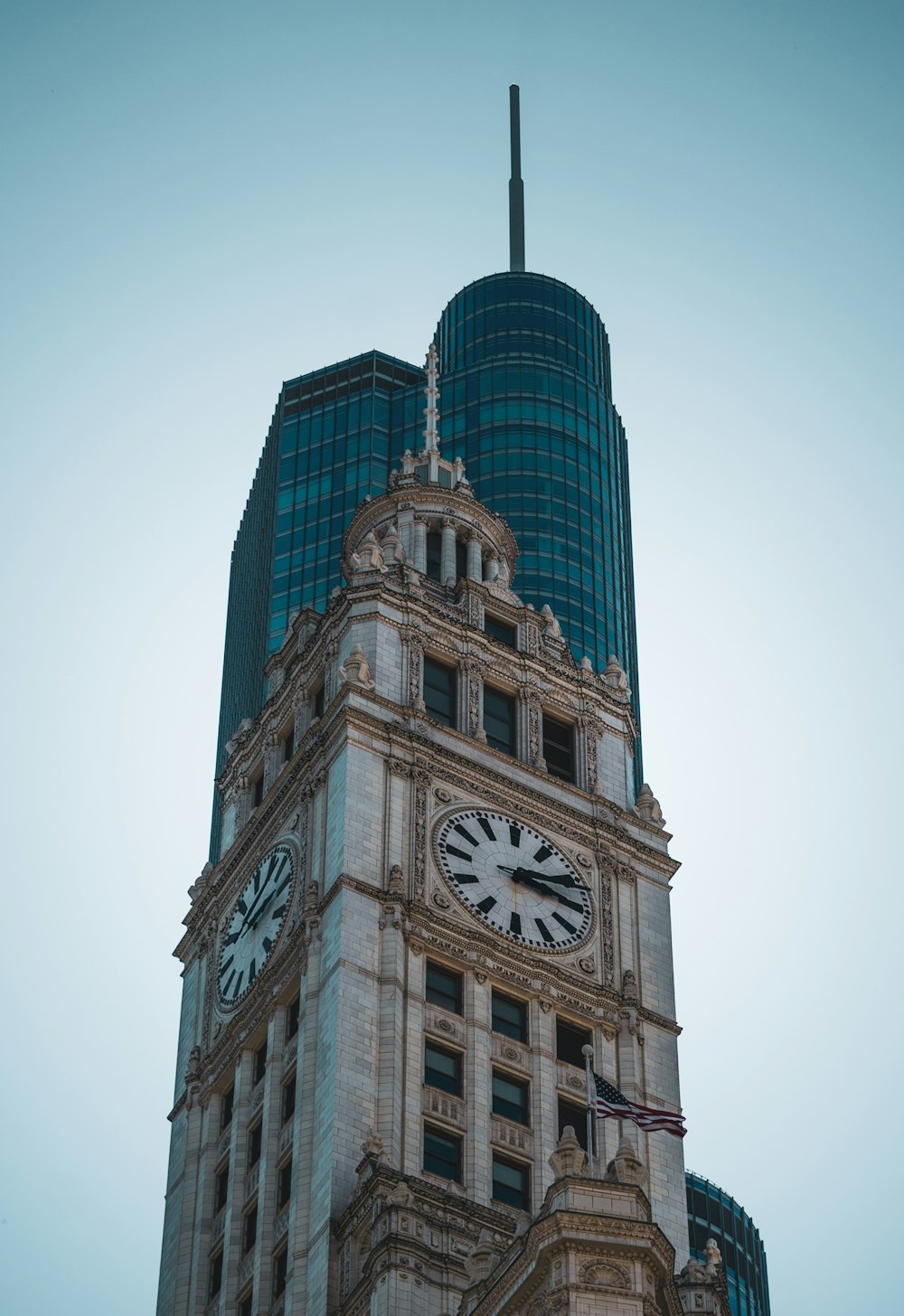 a clock tower with a weather vane