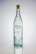 A tall, clear glass bottle with a cork stopper. The bottle has bubbles trapped within the glass and a label featuring the brand name 'Porfidio'. The text indicates it's made from 100% blue agave, cold-pressed, and triple-distilled.