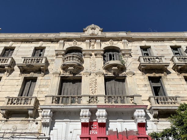 The historic facade of belogradchik narodno chitalishte 'razvitie - 1893' on a sunny day.