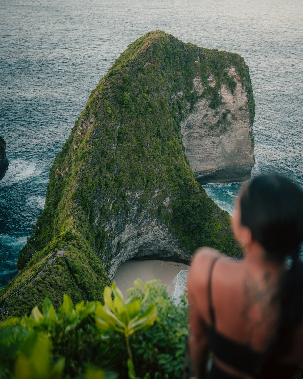 a person looking at a cliff