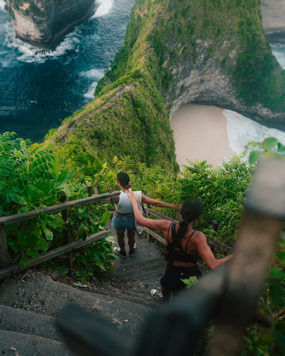 a group of people climbing a mountain