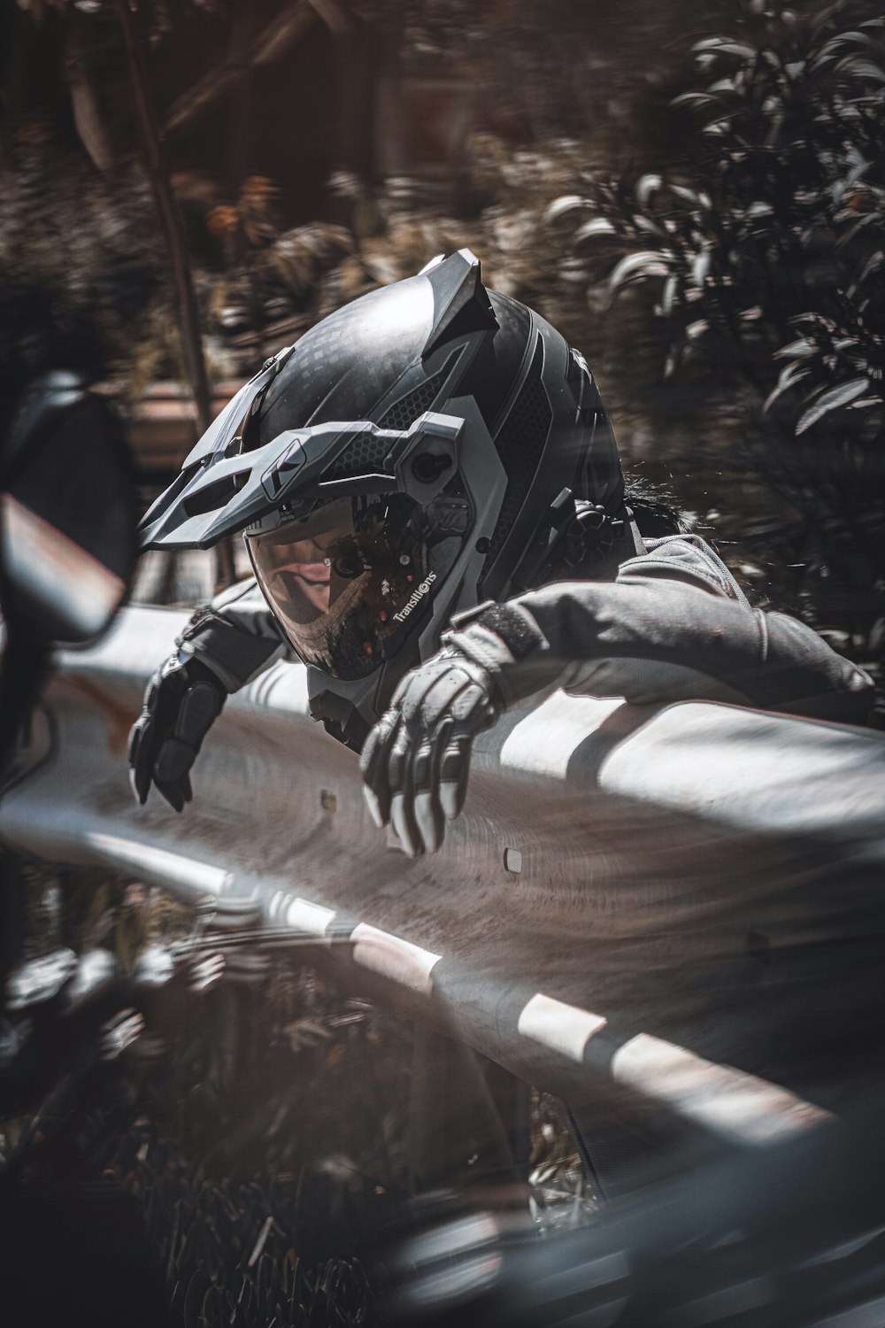 a man in a helmet and goggles holding a rifle