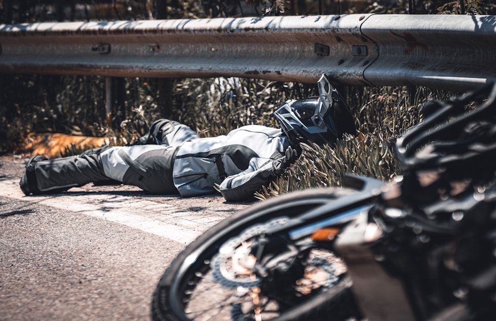 a person lying on a bench