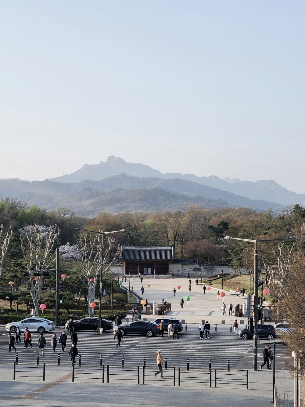 a city street with cars and people