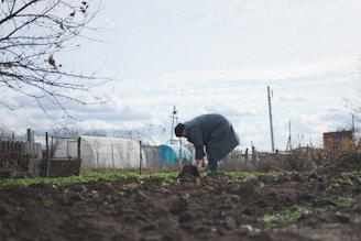 a man digging in the dirt