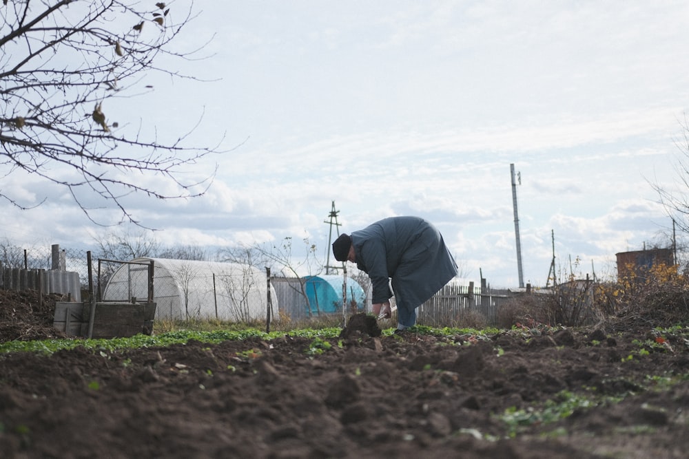 a man digging in the dirt