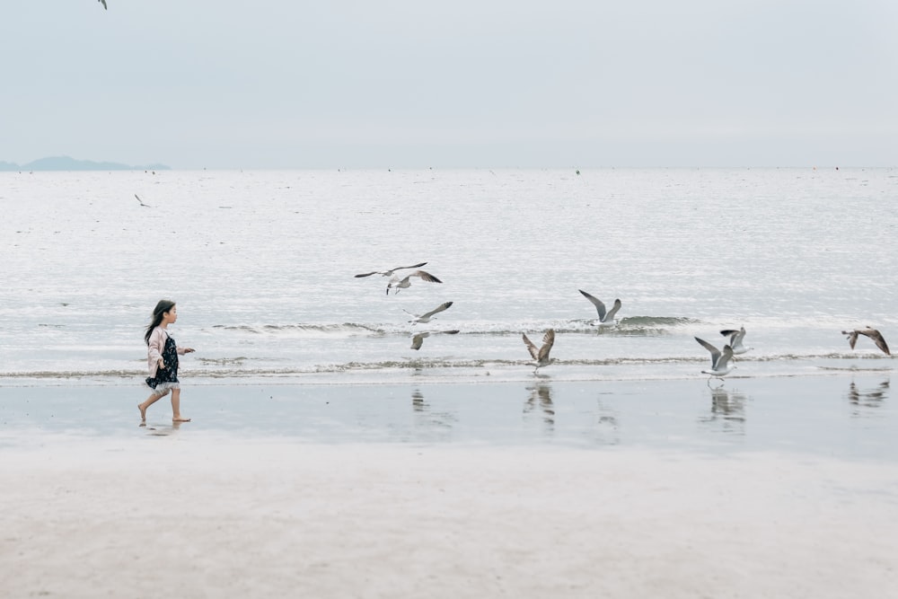 a person walking on the beach