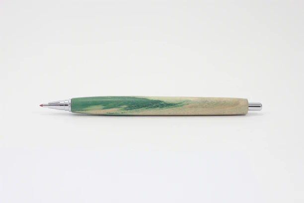 Close-up of a sleek emerald green premium promotional pen with golden accents on a clean white background.
