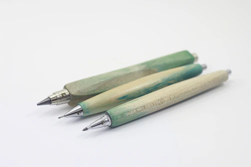 A set of personalized wooden pencils with precise laser-engraved names on each