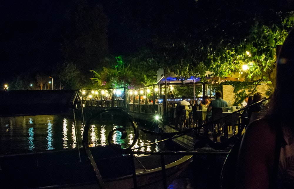 a group of people on a boat at night