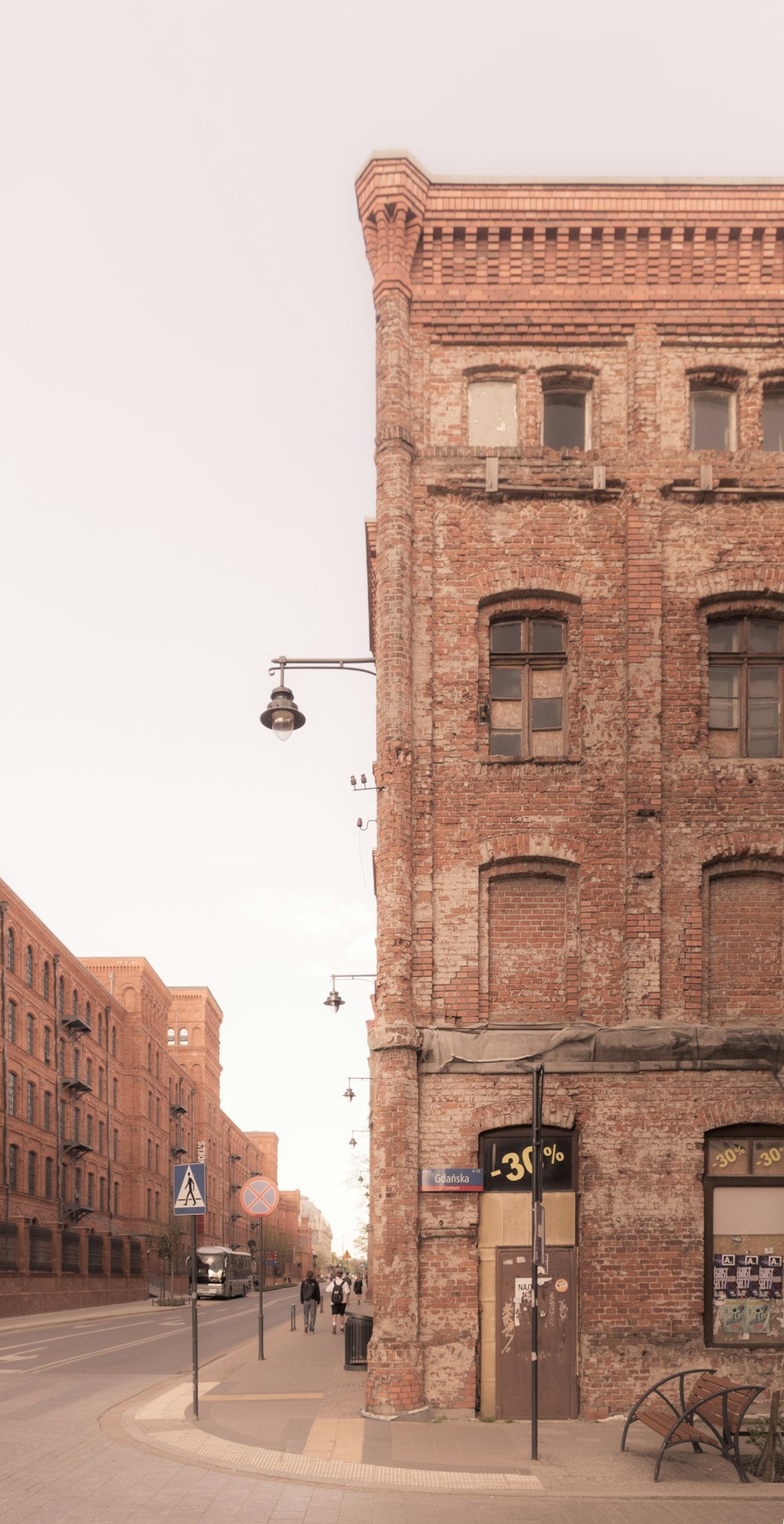 a brick building with a sign on it