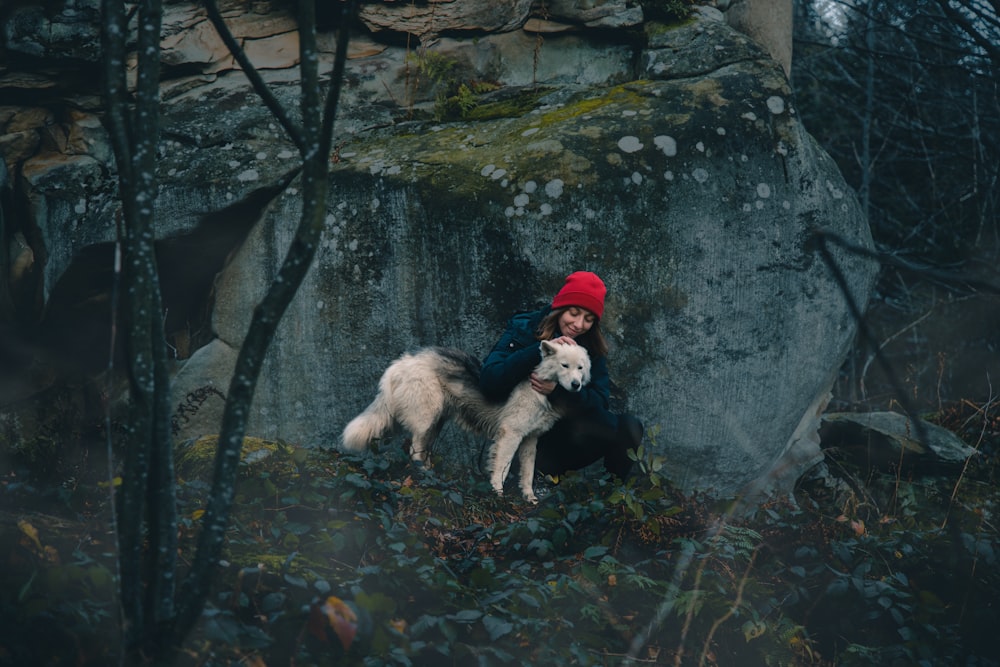 a person and a dog in a forest