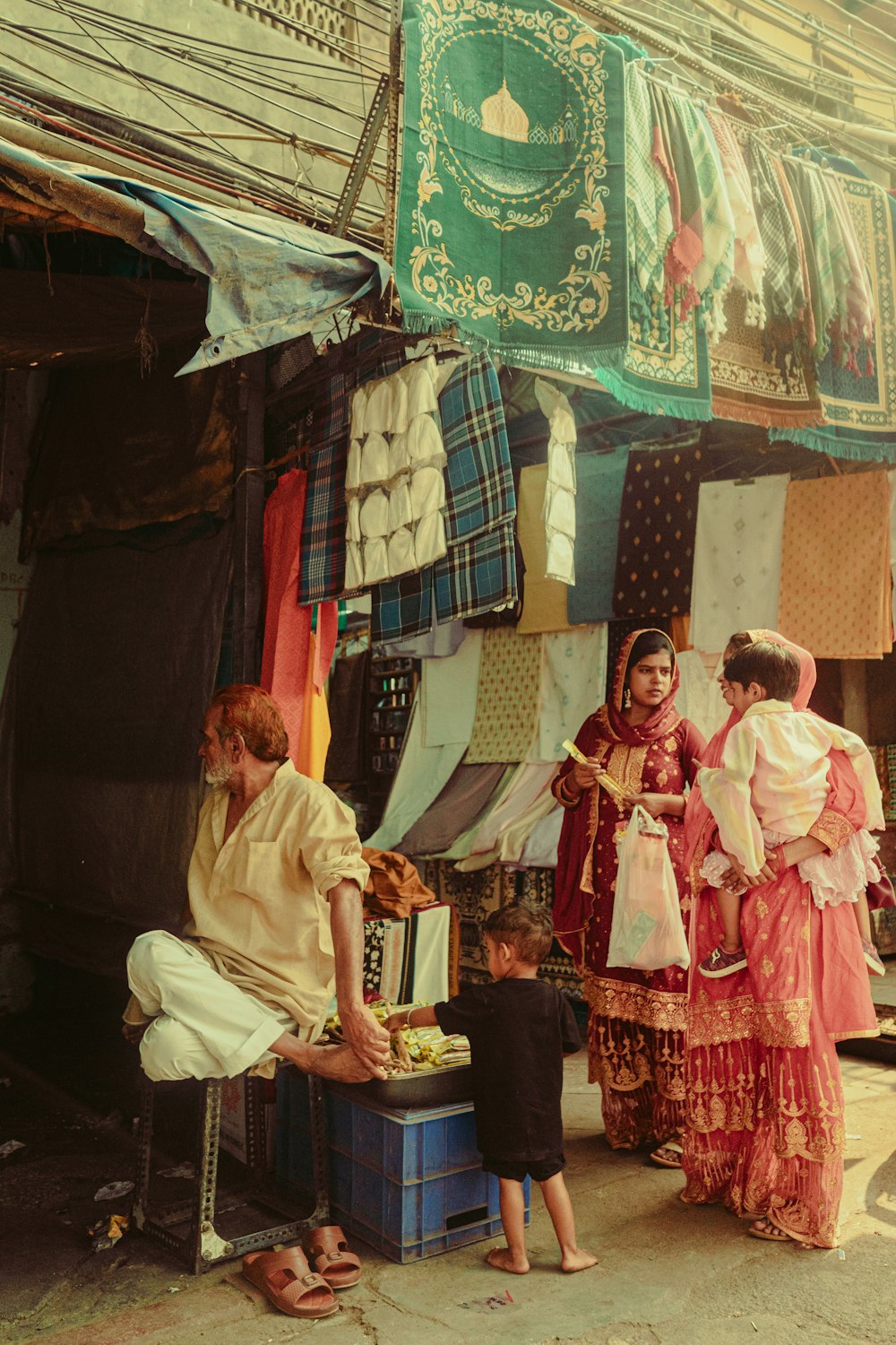 a group of women and a child in a small village