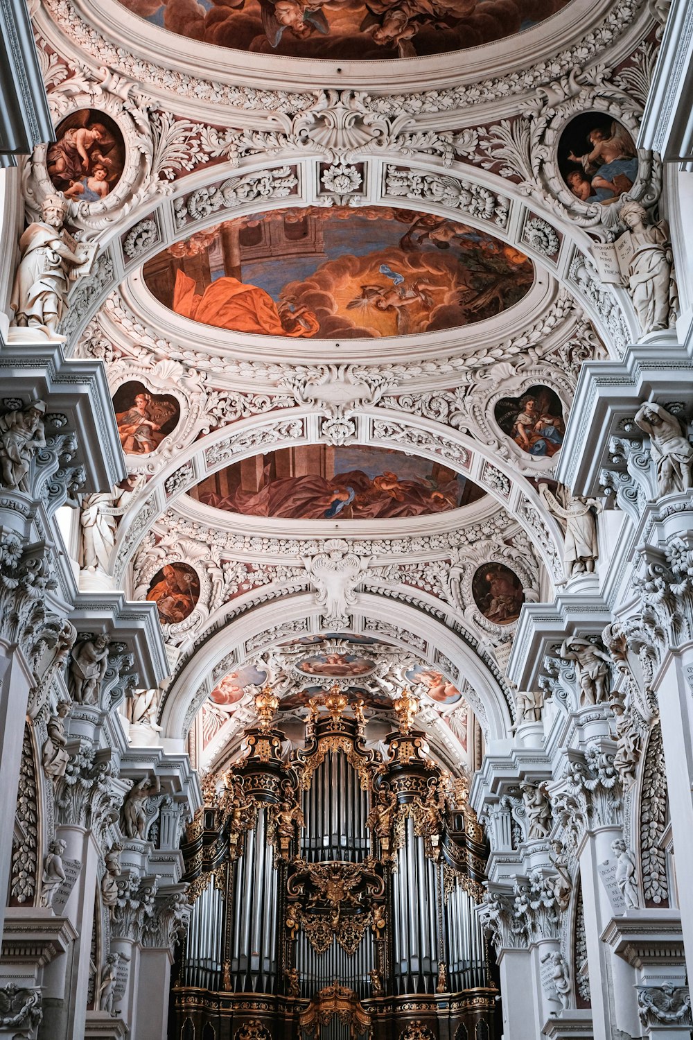 a large ornate ceiling with paintings