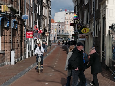 a person riding a bicycle down a busy street