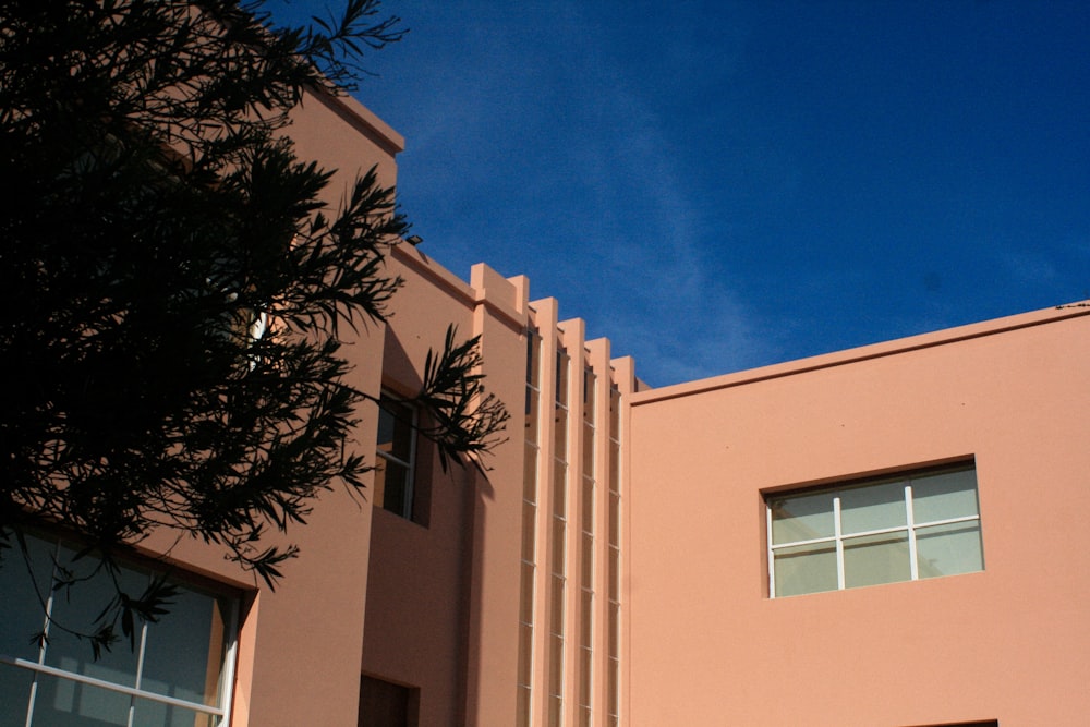 a building with a tree in the front