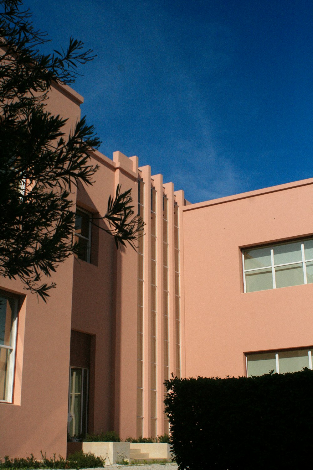 a building with a tree in front