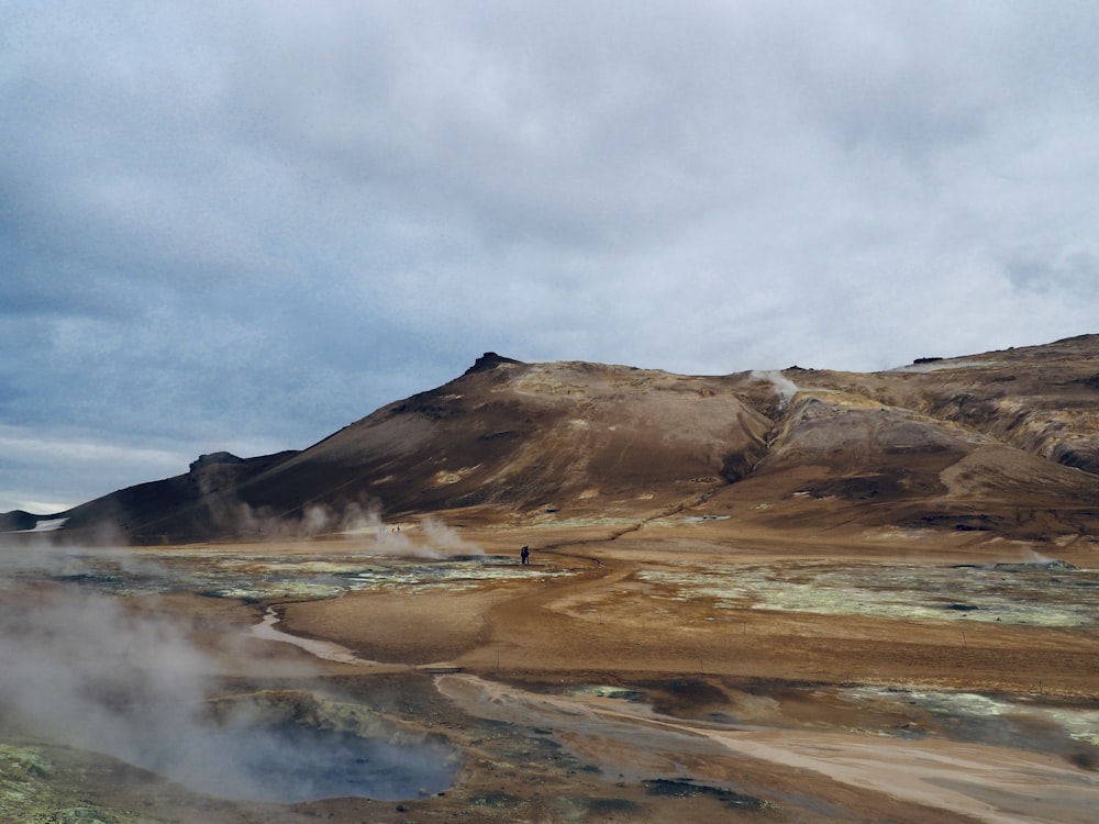 a person walking on a dirt road