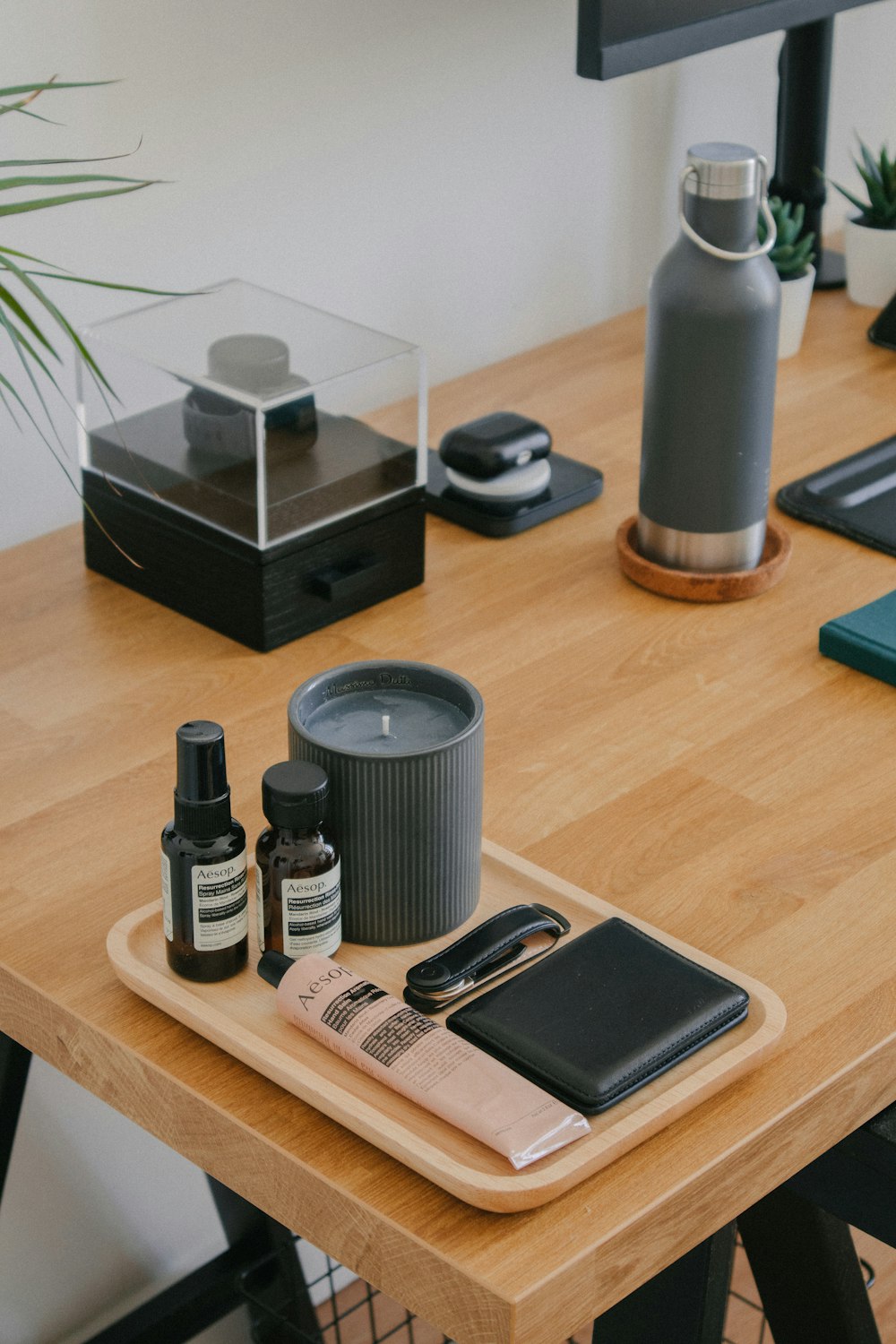 a table with a group of bottles and a cell phone on it