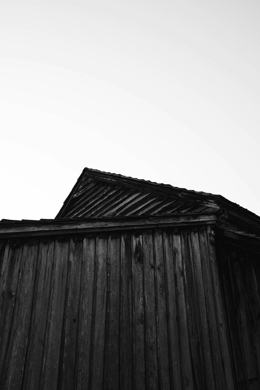 a wood building with a roof